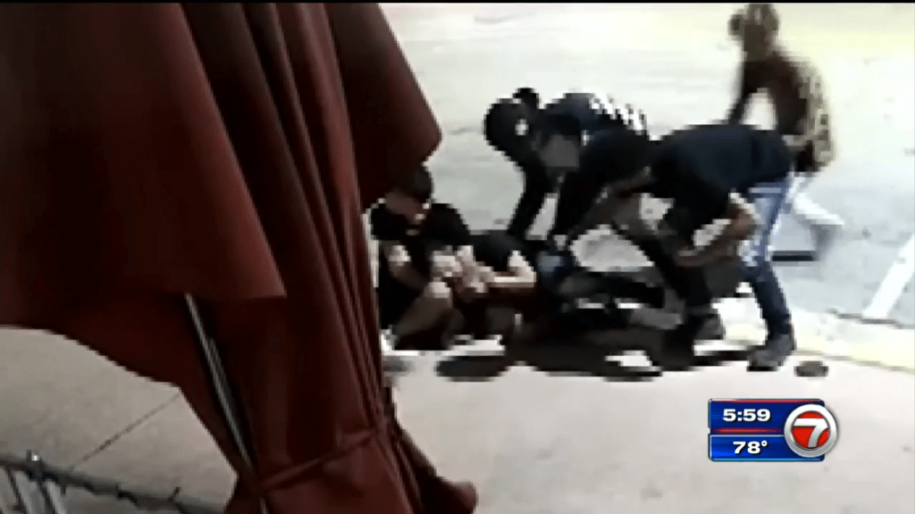 4 men assaulting, robbing tourist near Miami Beach police headquarters