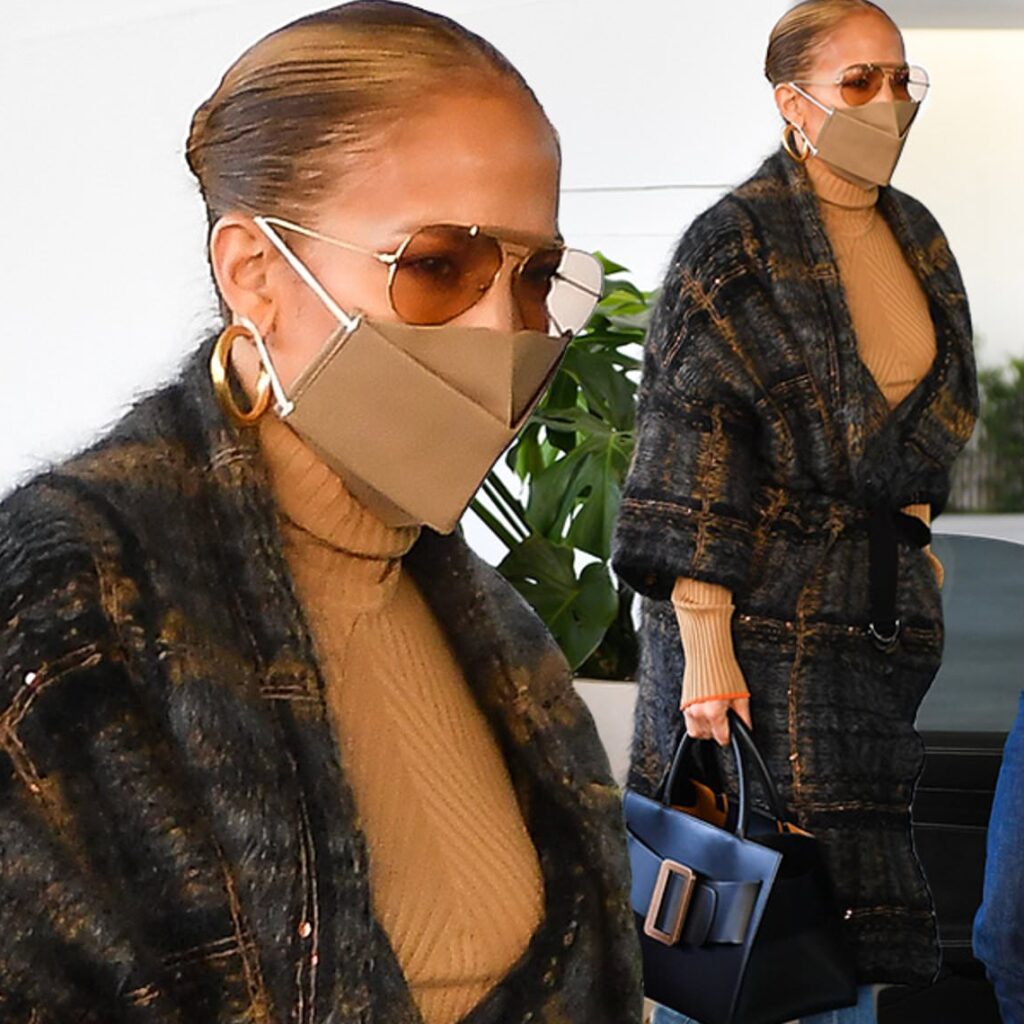 Jennifer Lopez looks stylish in a chic plaid coat and jeans for lunch in Miami