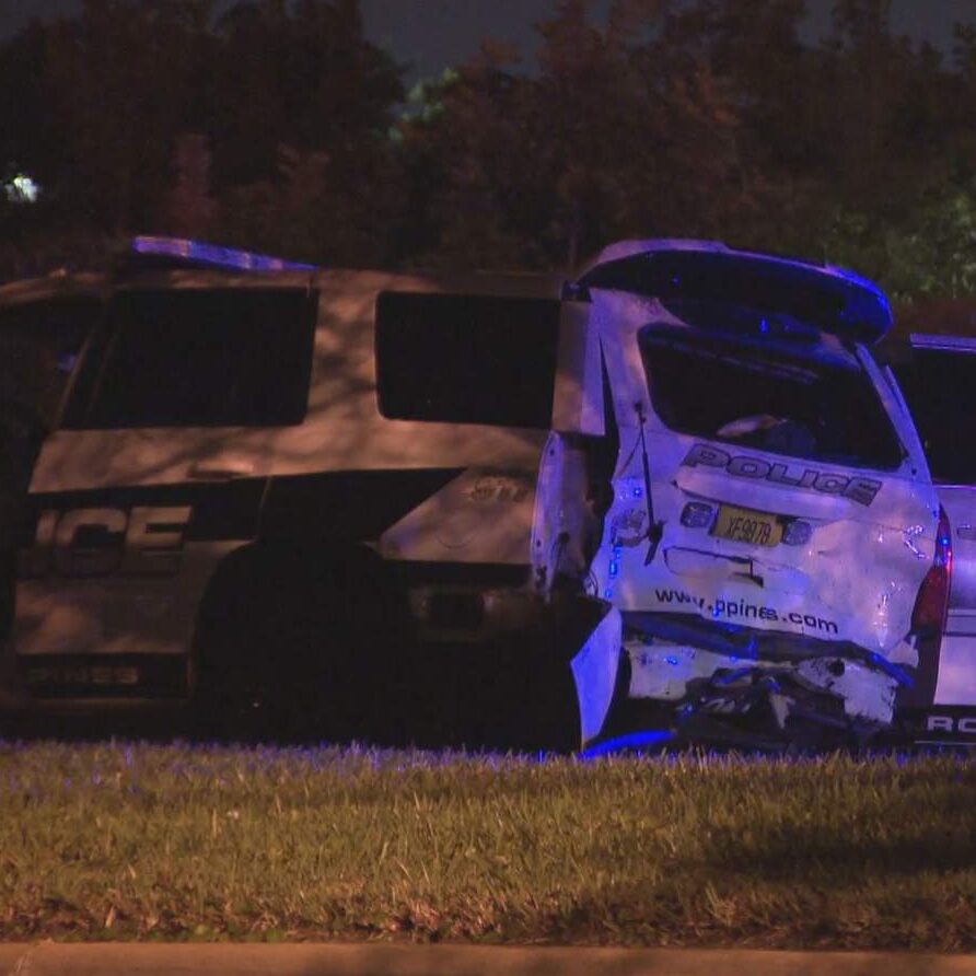 Car slams into marked police vehicle